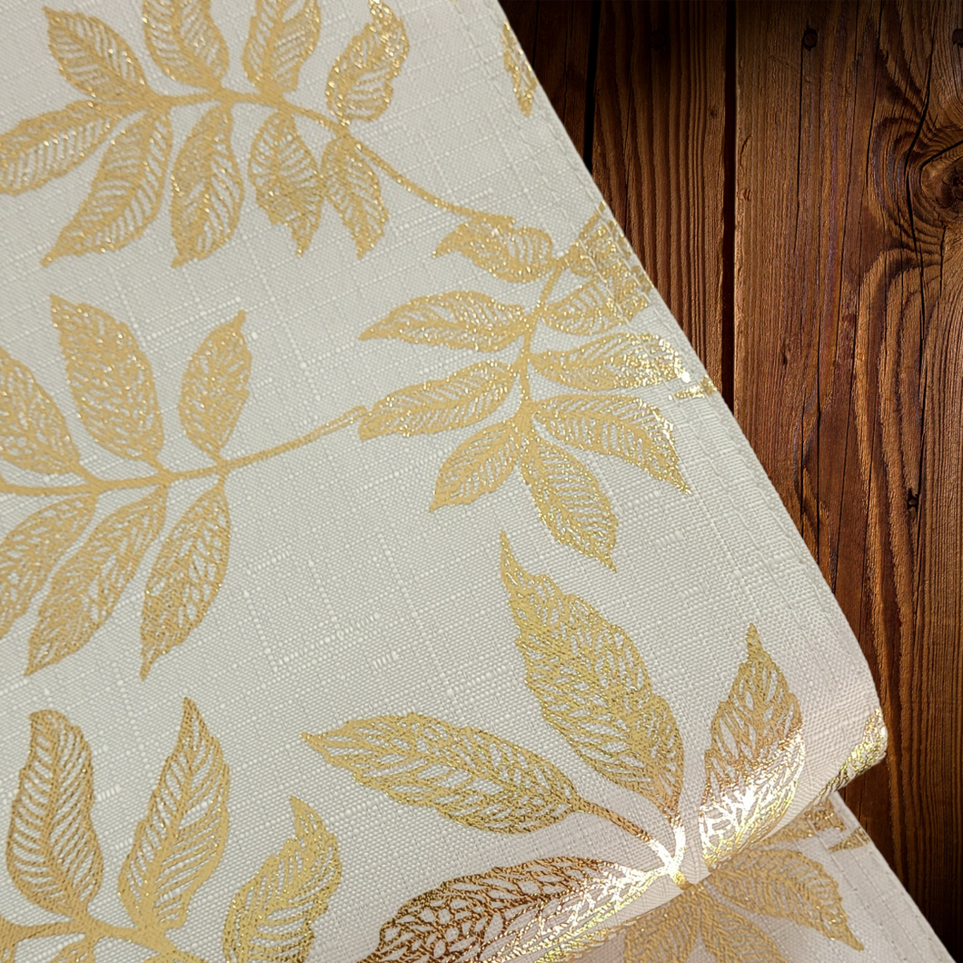 Camino de mesa ivory con estampado dorado. Unid.
